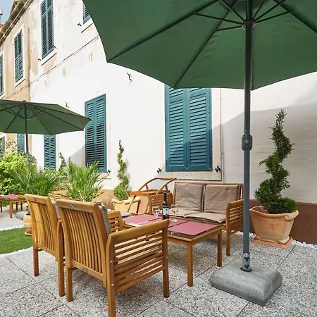 With Garden Next To Beach And Old Town